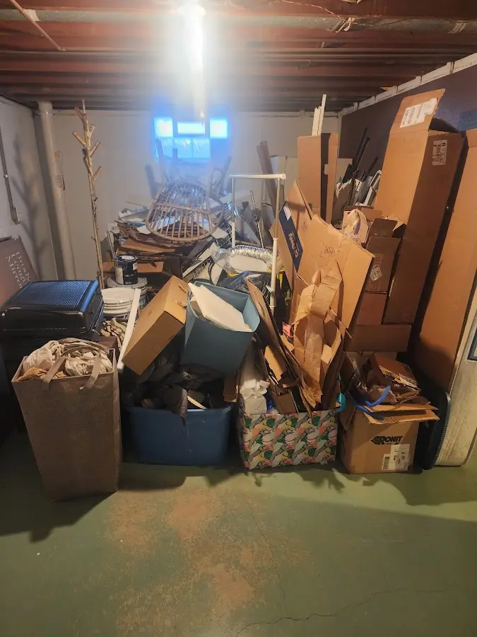 Roll-off dumpster container at job site for 2 Yard Dumpster Rental in Lewes