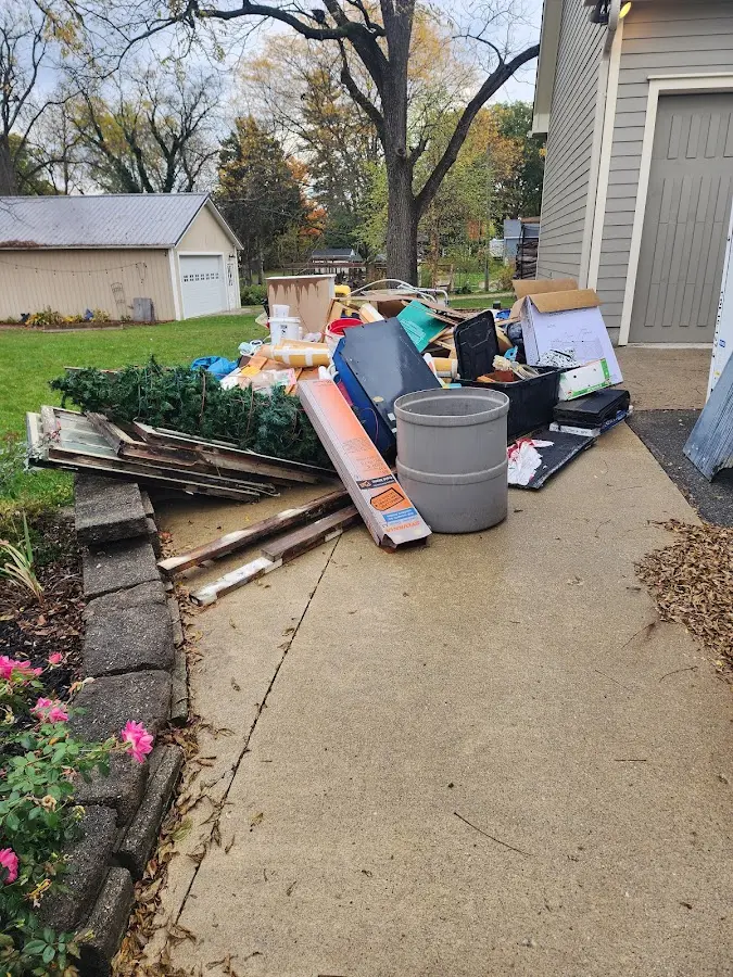 Dumpster being loaded with debris for 10 Yard Dumpster Rental in Lewes